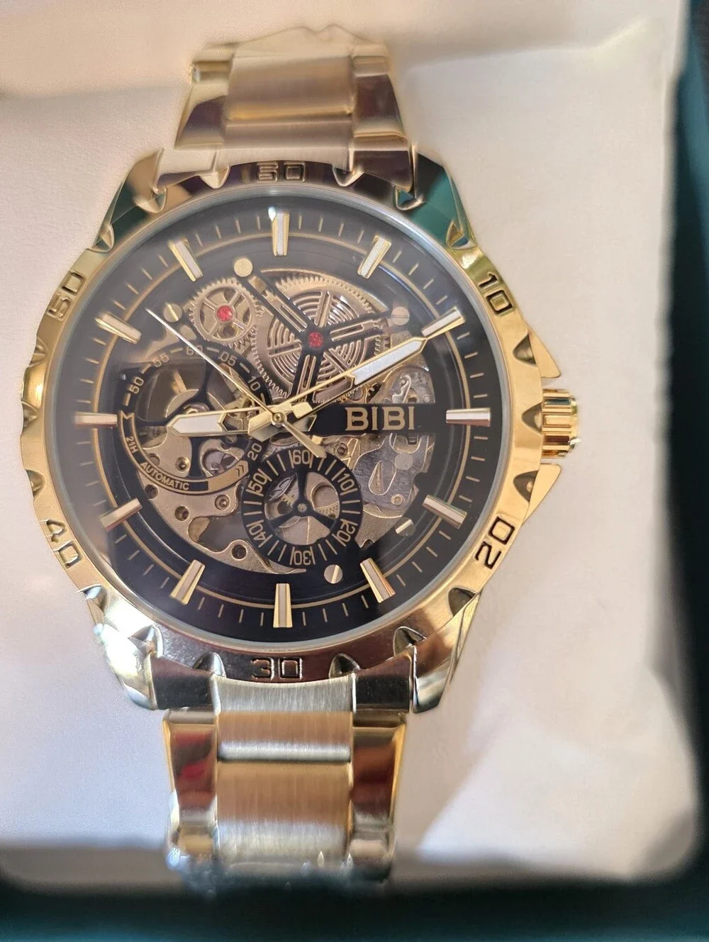 BiBi Gold Tone Skeleton Dial Watch with Black Accents